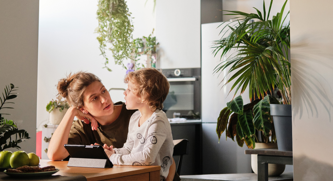 A mother talking to her son.