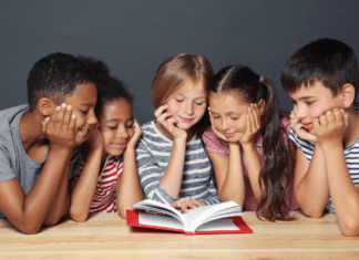 Celebrating Diversity Through Literature Diverse children reading a book together.