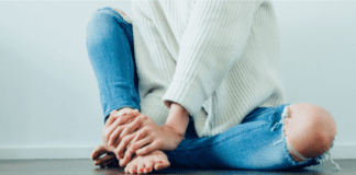 A woman sitting on the floor.