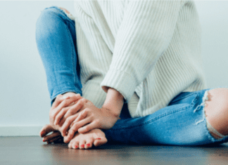It’s Always Something A woman sitting on the floor.