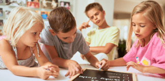 The Power of Behavior Charts KIds filling out a reward chart.