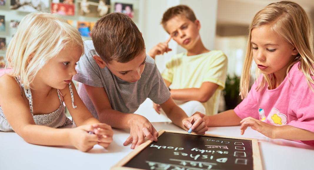 KIds filling out a reward chart. 