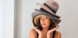 Meet Lelia: How Many Hatz Coaching A woman wearing a lot of hats.