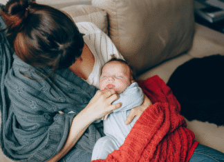 A mother holding her newborn.