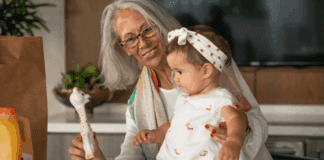 Mother Nature’s Promotion A grandmother holding her toddler granddaughter.