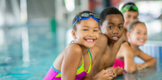 Swim Like a Fish at Goldfish Swim School Children at a swim class.