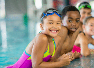 Swim Like a Fish at Goldfish Swim School Children at a swim class.