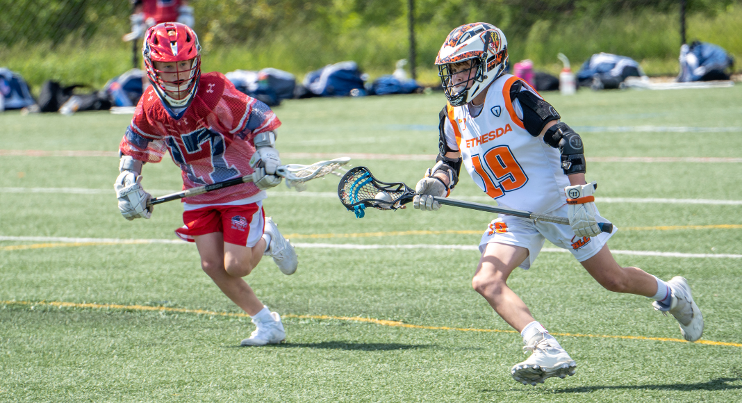 Boys playing lacrosse. 