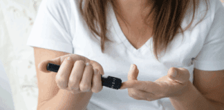 Reversing Prediabetes A woman checking her blood sugar.