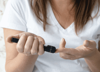 A woman checking her blood sugar.