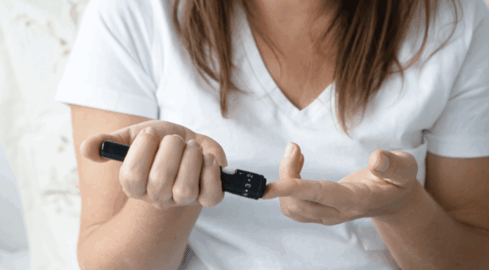 A woman checking her blood sugar.