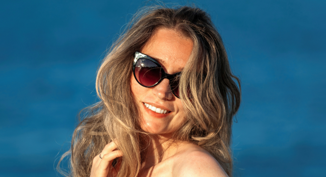 A woman wearing sunglasses.
