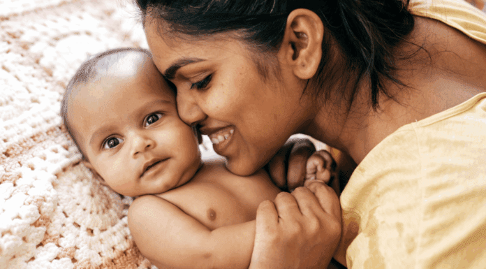 A mom loving her baby.