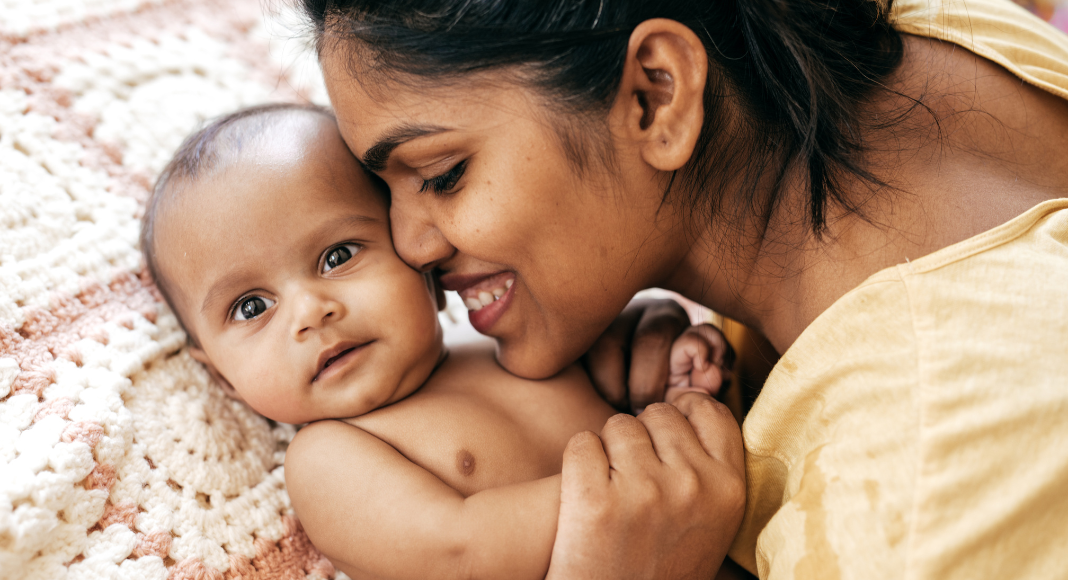 A mom loving her baby.