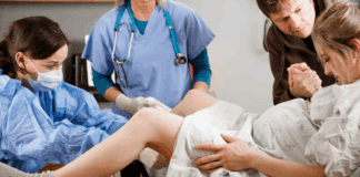 A woman giving birth.