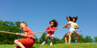Unplugging for 18 Delicious Summers Kids play tug-of-war.