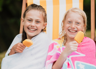 Taking a Summer Vacation From the Digital World Two girls eating popsicles.