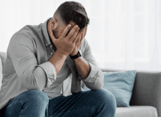 Is Your Husband Depressed? Here are Signs to Look For A man holding his face upset.