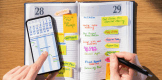 Why This Mama is Never Getting Rid of Her Agenda Book Writing in an agenda book.