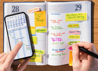 Why This Mama is Never Getting Rid of Her Agenda Book Writing in an agenda book.