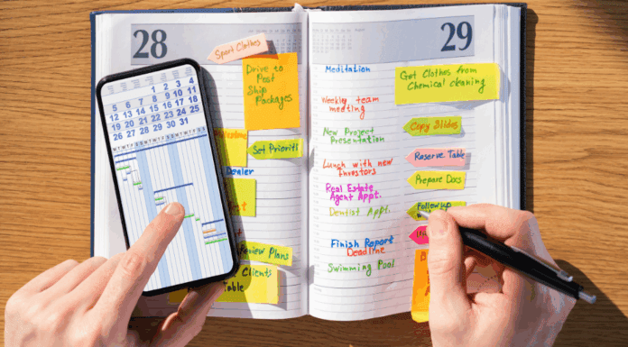 Why This Mama is Never Getting Rid of Her Agenda Book Writing in an agenda book.