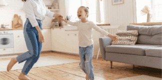 I Wish I Could Be More Like My Daughter A girl dancing in the living room.