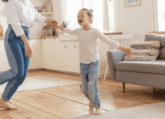 I Wish I Could Be More Like My Daughter A girl dancing in the living room.