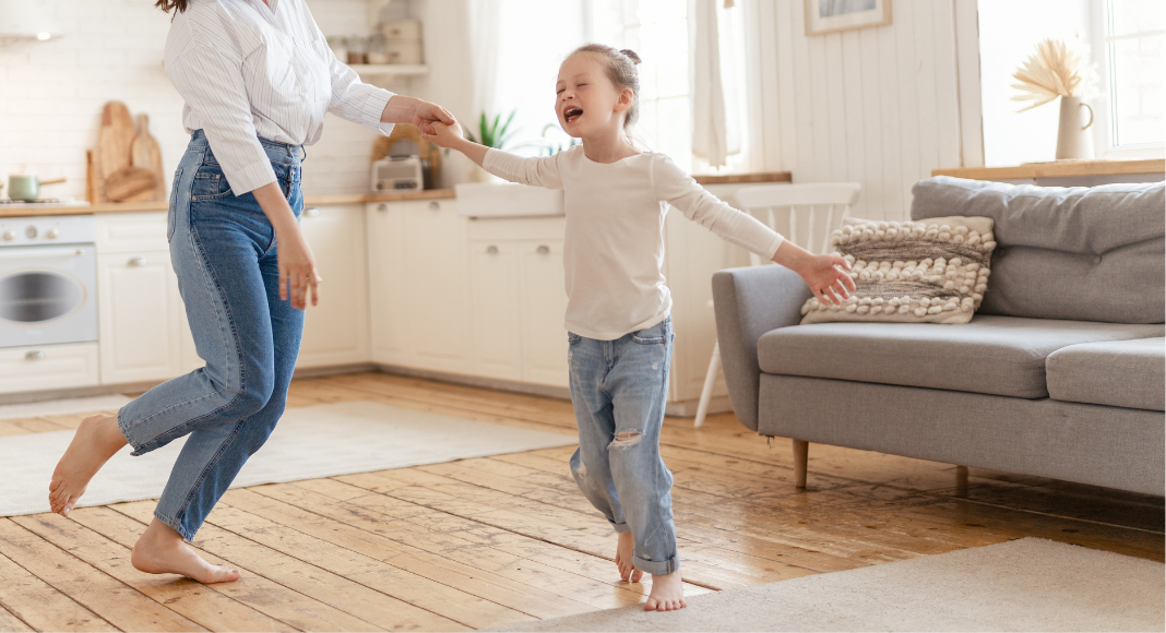 A girl dancing in the living room.