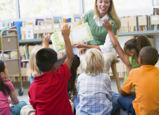 What Your Child Really Needs To Know Before Kindergarten Kindergartners listening to a story.
