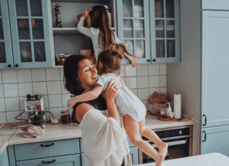 Real Parenting Advice A mom in the kitchen with her daughters climbing on the counters.