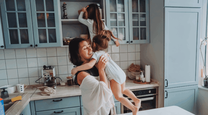 Real Parenting Advice A mom in the kitchen with her daughters climbing on the counters.