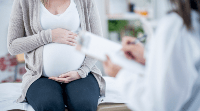 A pregnant woman at the doctor.