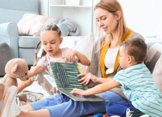 Nanny Taxes Made Easy A nanny reading to children.