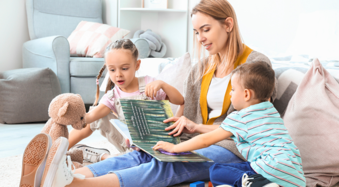 A nanny reading to children.