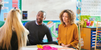 Establishing a Positive Parent-Teacher Partnership Parents sitting at a conference with their child's teacher.