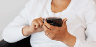 A woman scrolling on her phone.