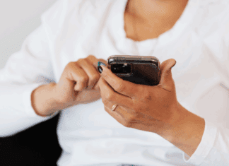The Bitter Aftertaste of Social Media as a Mom A woman scrolling on her phone.