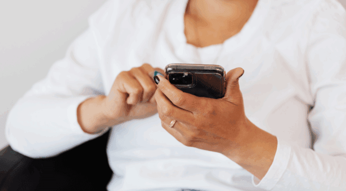 A woman scrolling on her phone.
