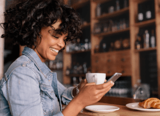 Westchester County Mom Top 10 Posts of 2019 A woman reading on her phone while drinking coffee.
