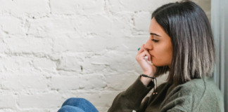 A woman sitting in sadness.