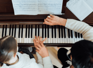Making music on the piano with music lessons.
