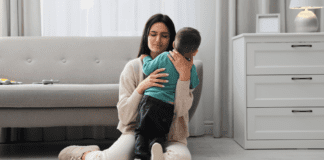 What Motherhood and Anxiety Have Taught Me A mom holding her anxious son.