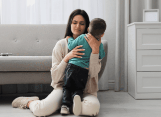 What Motherhood and Anxiety Have Taught Me A mom holding her anxious son.