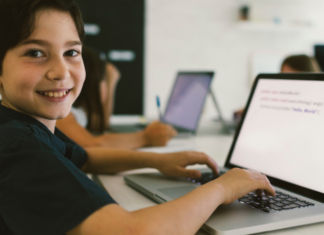 Codeverse, the World’s First Interactive Coding Studio for Kids A boy coding on the computer.