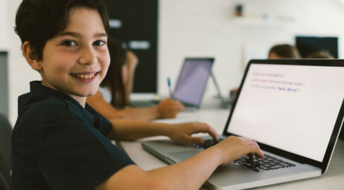 Codeverse, the World’s First Interactive Coding Studio for Kids A boy coding on the computer.