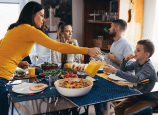 A Mother Always Makes Room at the Table A mother feeding her family at the table.
