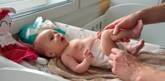 Baby Hacks for New Moms Changing a baby's diaper.