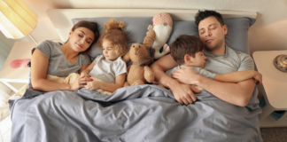 The ABCs of the Primary Bedroom A family sleeping in the primary bedroom.