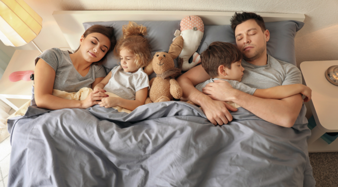 The ABCs of the Primary Bedroom A family sleeping in the primary bedroom.