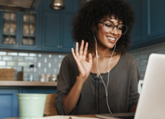 A woman on a Zoom call with a virtual friend.